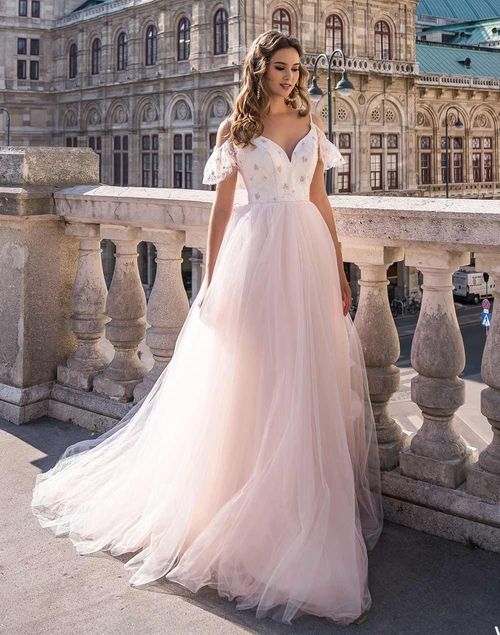 Wedding dress with embroidered bodice and tulle skirt