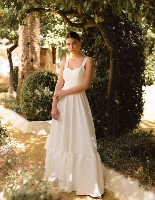Long wedding dress with straps, sweetheart neckline and flared skirt