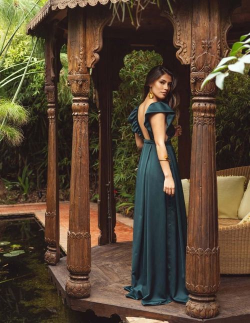 Long emerald green party dress with V-neckline