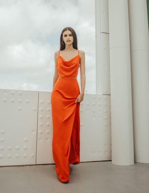 Long coral cut out party dress with draped neckline