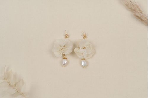 Earrings adorned with preserved hydrangea flowers and fine freshwater pearls