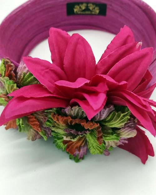 Sinamay silk turban adorned with velvety flowers