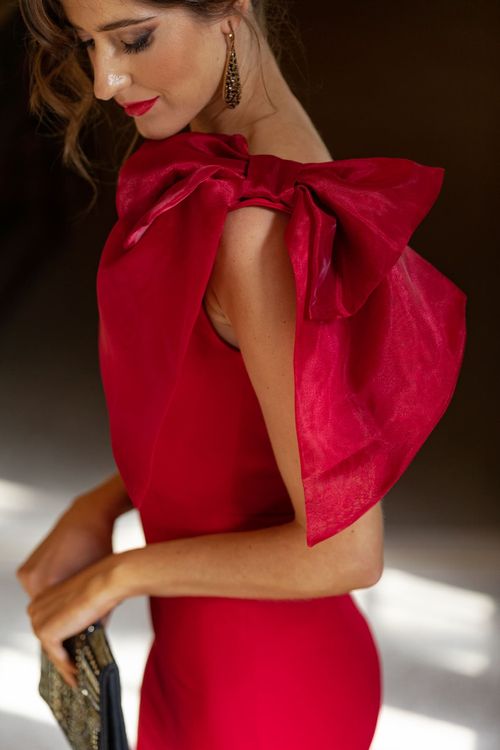 Long red asymmetrical cocktail dress with organza bow on the shoulder