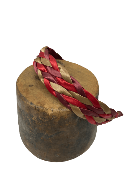 Diadema trenzada spaguetti en tonos rojo, granate y beige