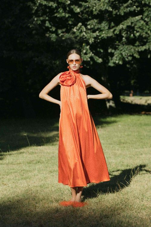 Orange midi dress with fantasy fabric and halter neckline