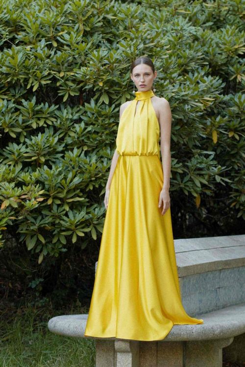 Long yellow dress with halter neckline and straps